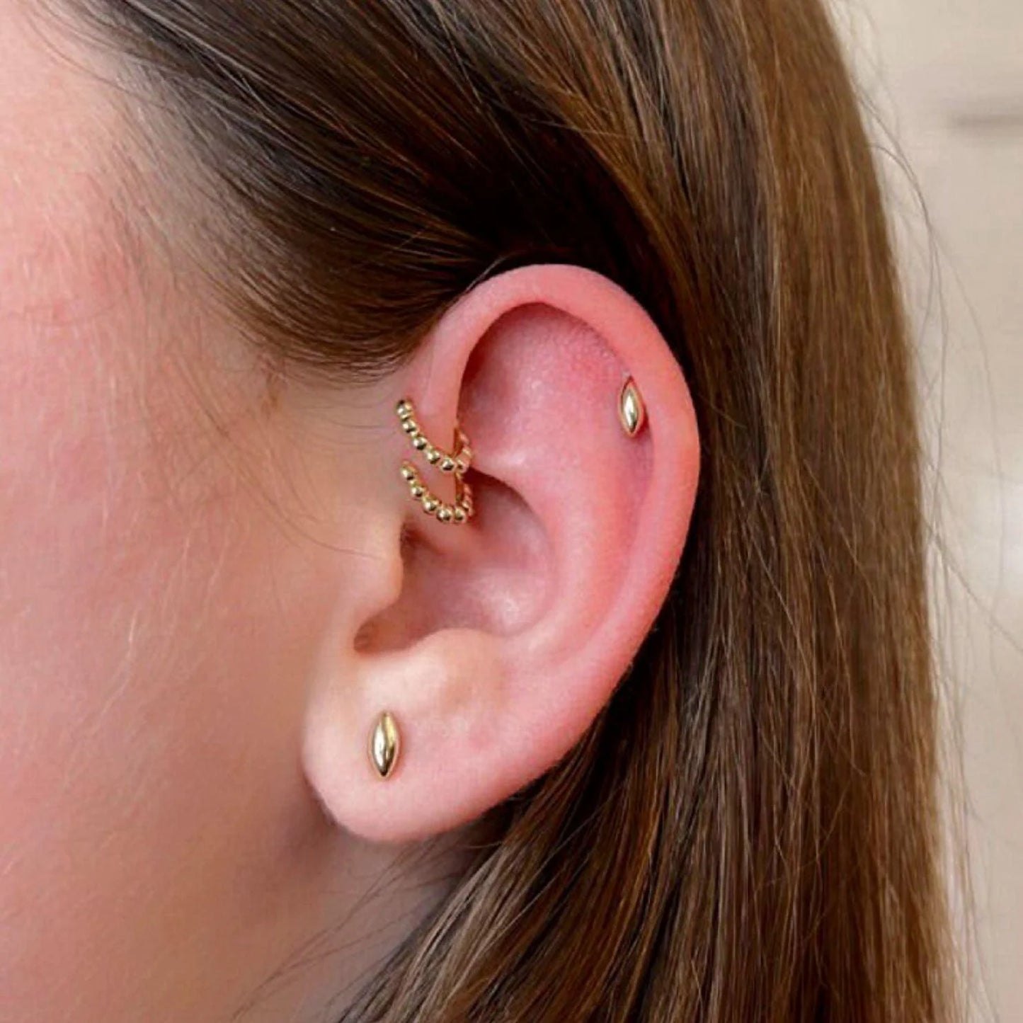 Perla small gold beaded huggie hoop earring