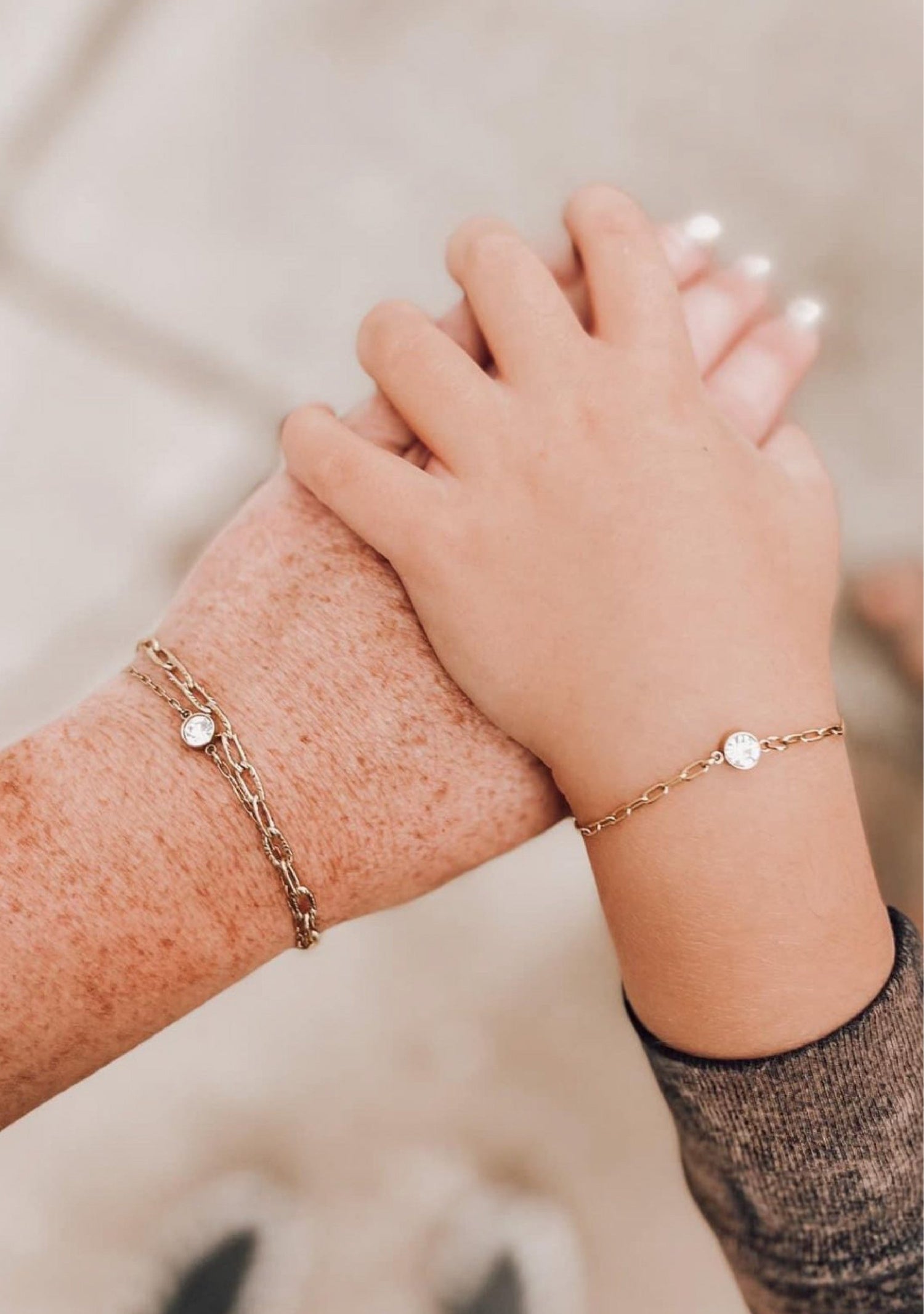 Two hands with matching permanent welded jewellery